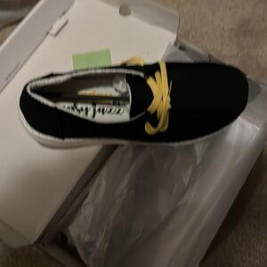 Brand new still in the box gypsy jazz shoes they are black with yellow laces.